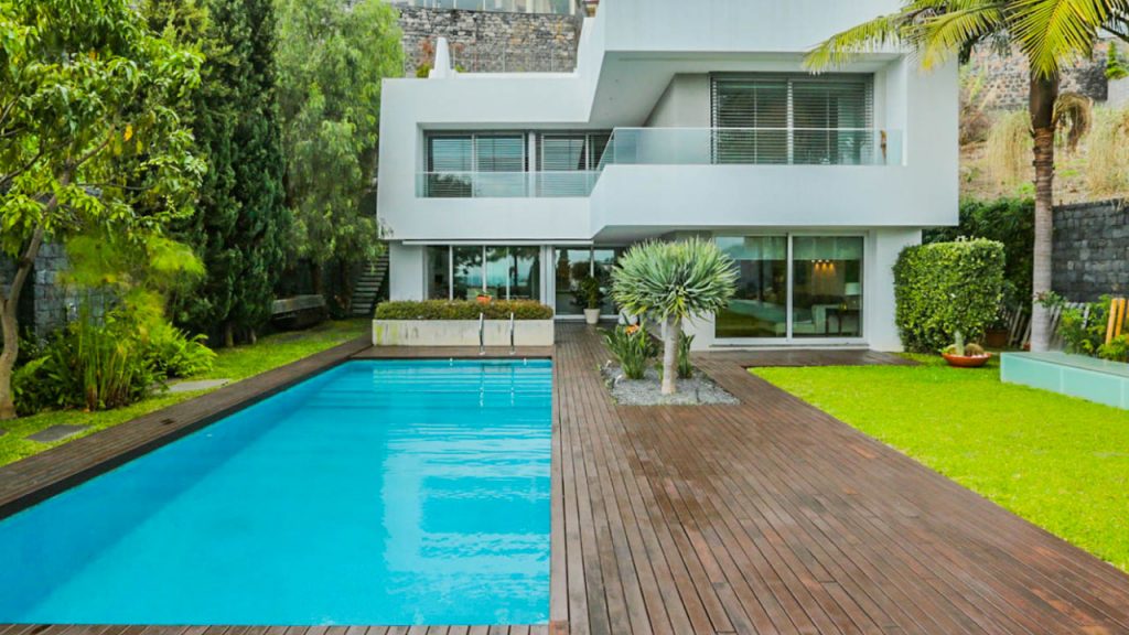 a beautiful house with a pool
